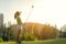 Golfer sport approach on course golf ball fairway.Â  People lifestyle woman playing game golf tee